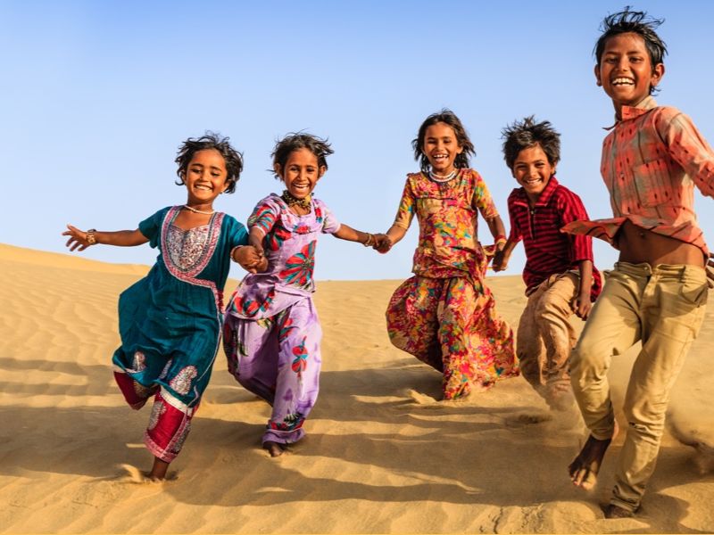 Indian children holding hands
