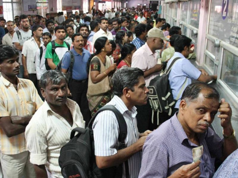 Huge crowd at train ticket booking office.