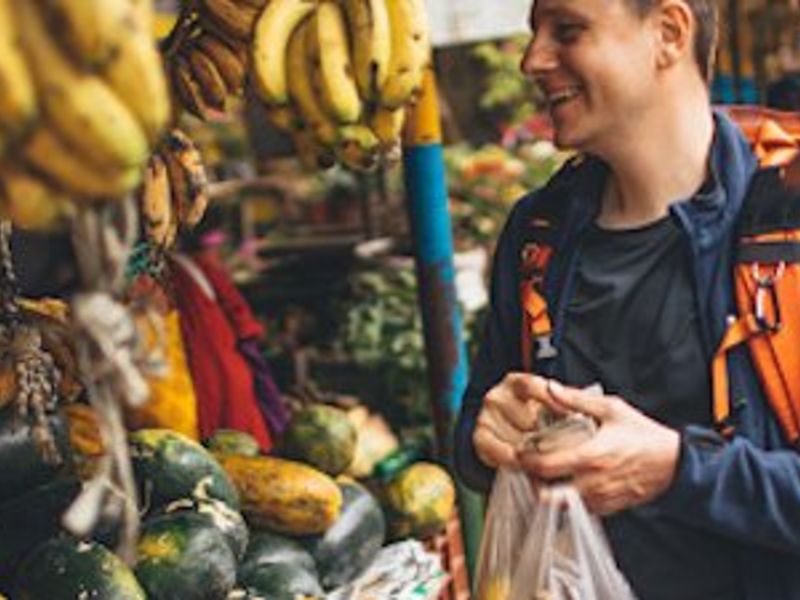 Travelers buying fruits