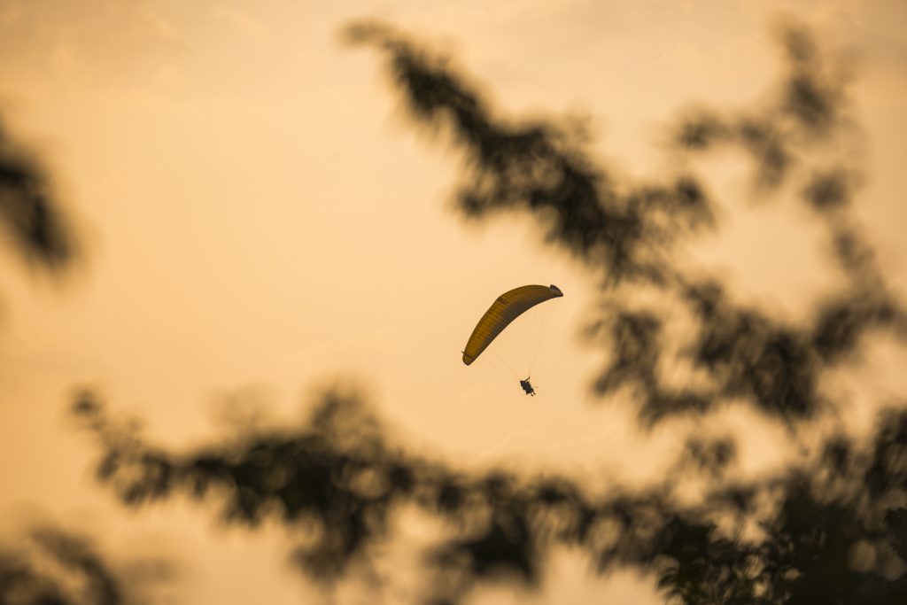 Beautiful view of paragliders in the sky from the rooftop